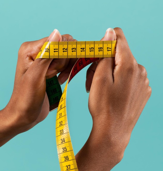Female hand holding measuring tape